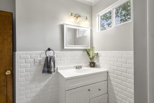150 Church Ave, Warwick, RI 02889 - bathroom featuring vanity, tile walls, a wainscoted wall, and crown molding