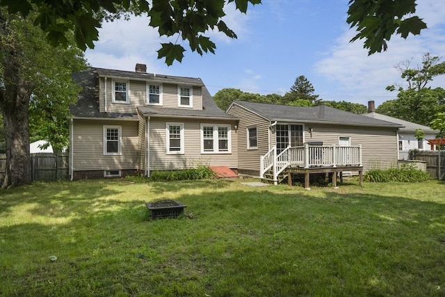 150 Church Ave, Warwick, RI 02889 - back of property with a deck, a chimney, and a fire pit