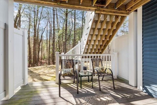 wooden terrace featuring stairs