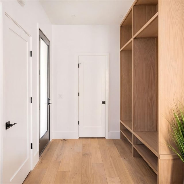 mudroom with light hardwood / wood-style flooring