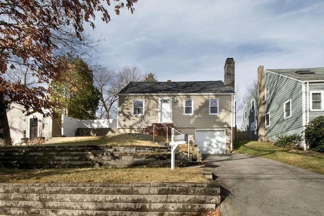 view of front of property with a garage