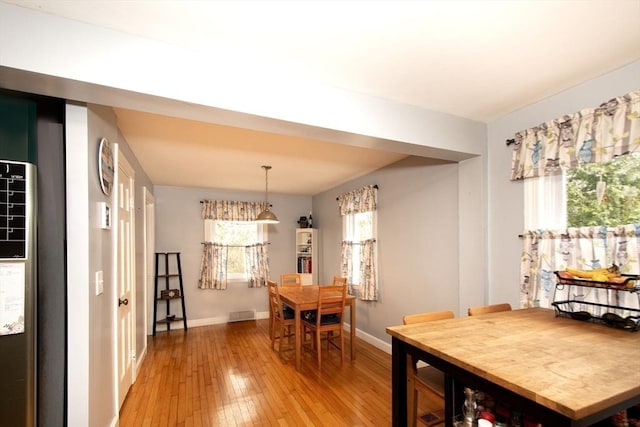 dining area with light hardwood / wood-style flooring