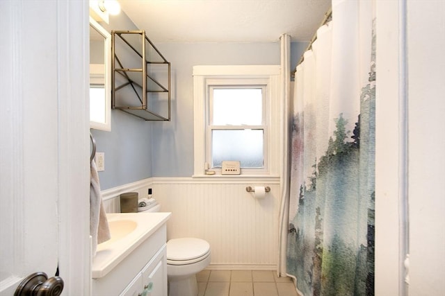 bathroom with tile patterned floors, vanity, and toilet