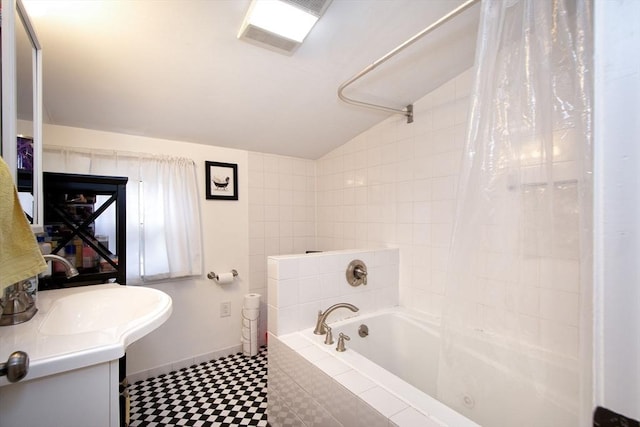 bathroom with shower / tub combo, vanity, and lofted ceiling