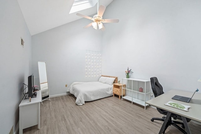 42 2nd Ave Unit 40, North Attleboro, MA 02760 - bedroom with high vaulted ceiling, wood finished floors, a desk, a skylight, and a ceiling fan