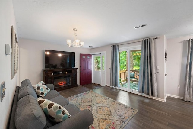 42 2nd Ave Unit 40, North Attleboro, MA 02760 - living room featuring wood finished floors, a chandelier, and a glass covered fireplace