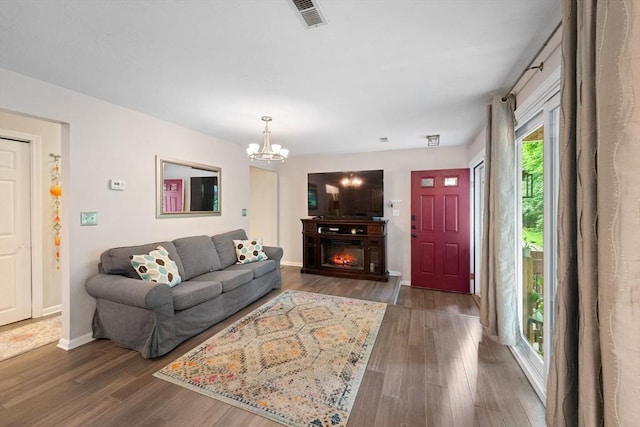 42 2nd Ave Unit 40, North Attleboro, MA 02760 - living room with wood finished floors, a chandelier, and a glass covered fireplace