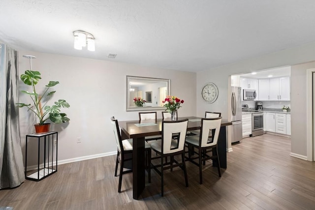 42 2nd Ave Unit 40, North Attleboro, MA 02760 - dining space with dark wood-type flooring and baseboards