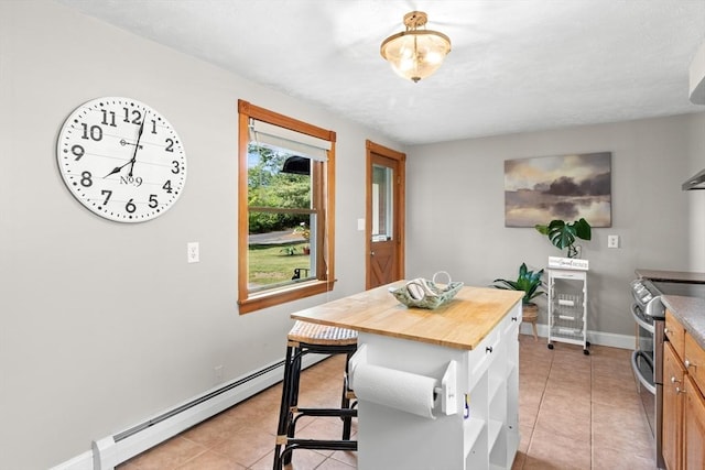 3 Scotland Heights Rd, Haverhill, MA 01832 - kitchen with range with two ovens, baseboard heating, light tile patterned floors, and wooden counters