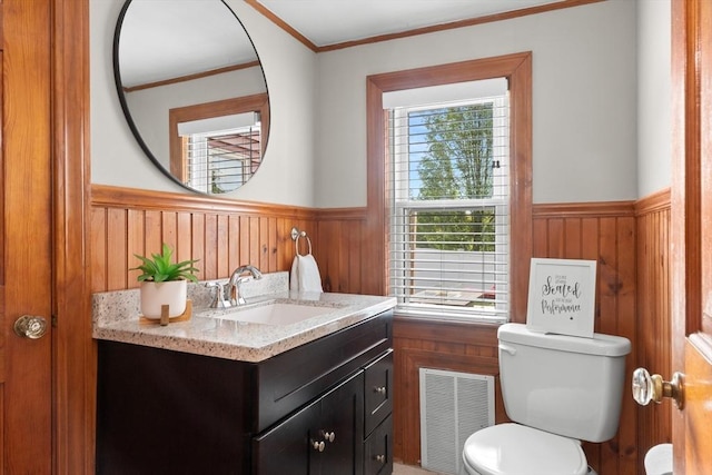 3 Scotland Heights Rd, Haverhill, MA 01832 - half bathroom with wainscoting, vanity, toilet, crown molding, and wood walls