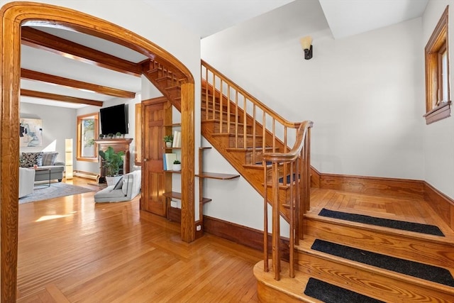 3 Scotland Heights Rd, Haverhill, MA 01832 - staircase with wood finished floors, baseboards, beam ceiling, and baseboard heating