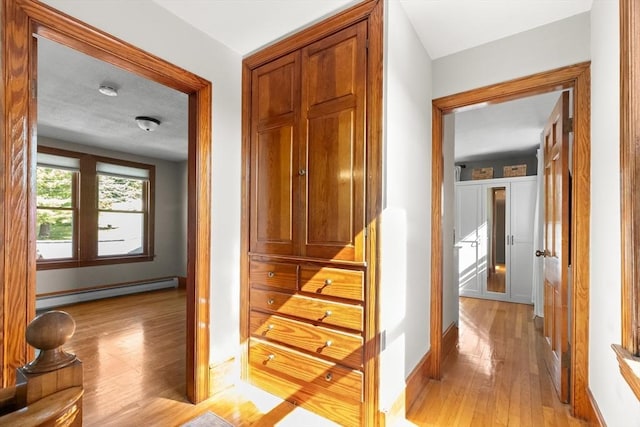 3 Scotland Heights Rd, Haverhill, MA 01832 - hall with baseboard heating, light wood-style floors, and baseboards