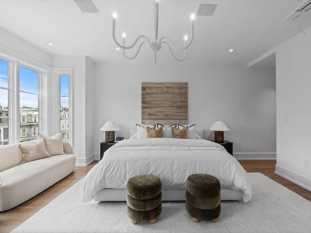 559 E Broadway Unit 559, Boston, MA 02127 - bedroom with a chandelier, recessed lighting, and wood finished floors