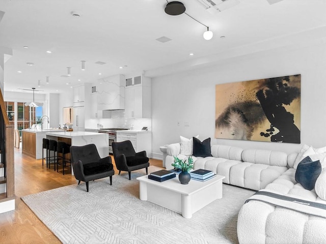 559 E Broadway Unit 559, Boston, MA 02127 - living area with light wood-type flooring, recessed lighting, and rail lighting