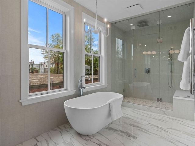559 E Broadway Unit 559, Boston, MA 02127 - full bath with a freestanding bath, a shower stall, and marble finish flooring