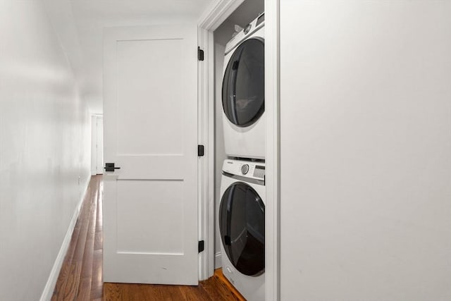 109 Eutaw St, Boston, MA 02128 - washroom with baseboards, laundry area, stacked washer / drying machine, and wood finished floors