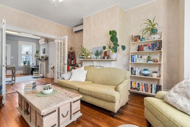 109 Eutaw St, Boston, MA 02128 - living area featuring hardwood / wood-style flooring, a wall mounted AC, a wall unit AC, and a ceiling fan