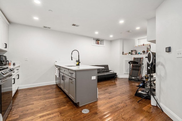 109 Eutaw St, Boston, MA 02128 - kitchen featuring recessed lighting, visible vents, a sink, a peninsula, and gray cabinets