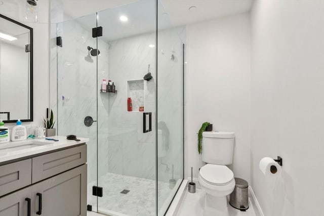 109 Eutaw St, Boston, MA 02128 - bathroom featuring toilet, baseboards, vanity, and a marble finish shower