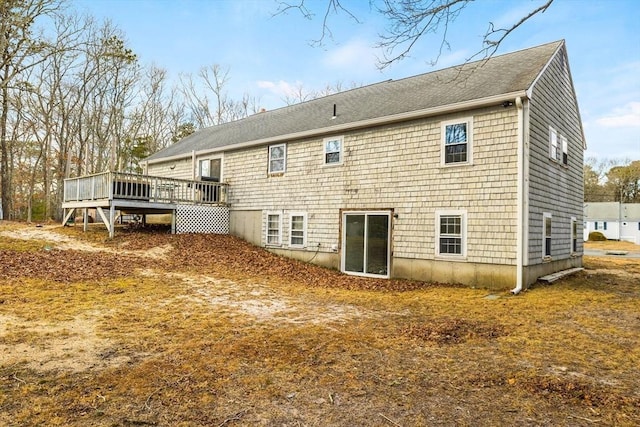 back of house featuring a wooden deck