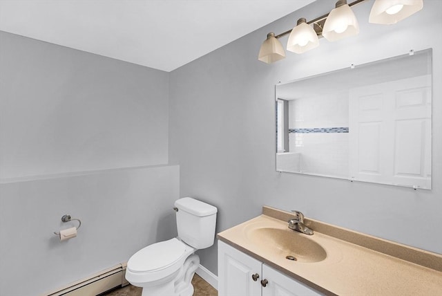 bathroom with baseboard heating, vanity, and toilet