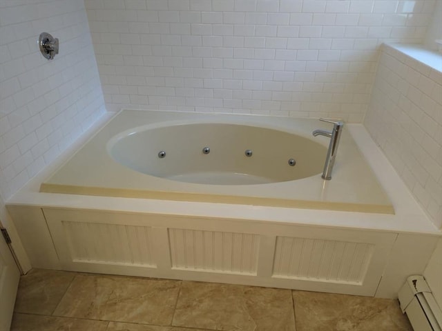 bathroom featuring a baseboard heating unit, a bath, and tile patterned floors