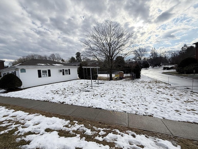 view of yard layered in snow