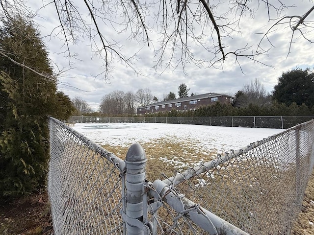 view of yard layered in snow