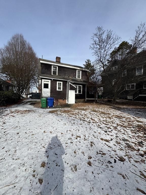 view of snow covered house