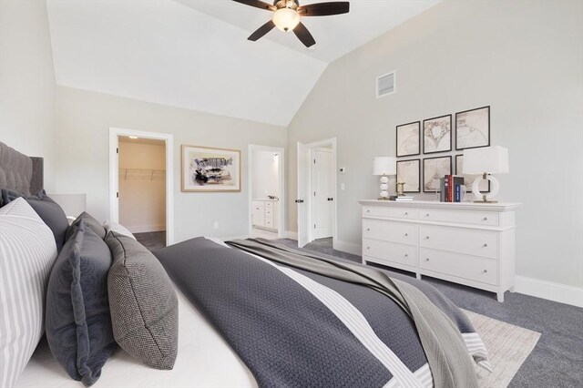 bedroom featuring vaulted ceiling, baseboards, visible vents, a spacious closet, and carpet floors
