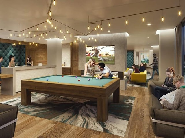 game room with pool table and light hardwood / wood-style flooring