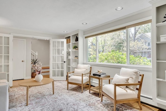 living area with ornamental molding, a wealth of natural light, and french doors