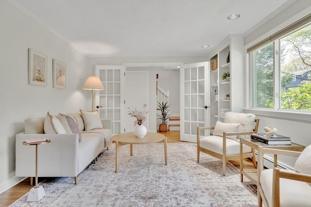 living room featuring ornamental molding, french doors, recessed lighting, and wood finished floors