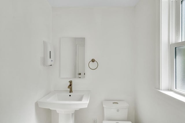bathroom featuring toilet and a sink