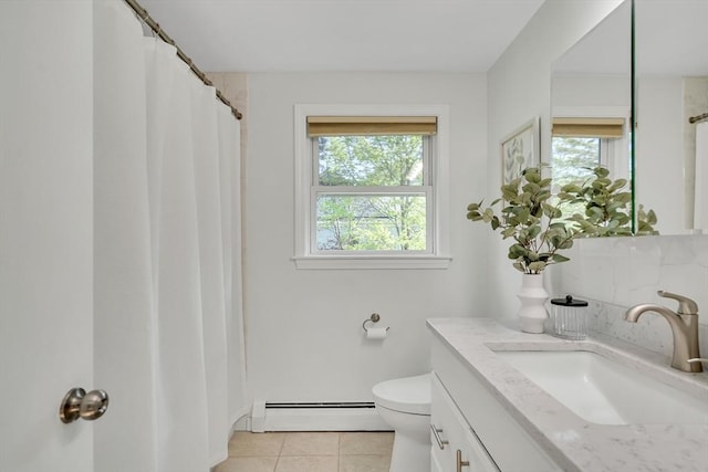 bathroom featuring baseboard heating, vanity, toilet, tile patterned floors, and a shower with shower curtain