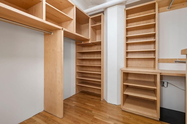 453 Washington St Unit 11E, Boston, MA 02111 - walk in closet with wood finished floors