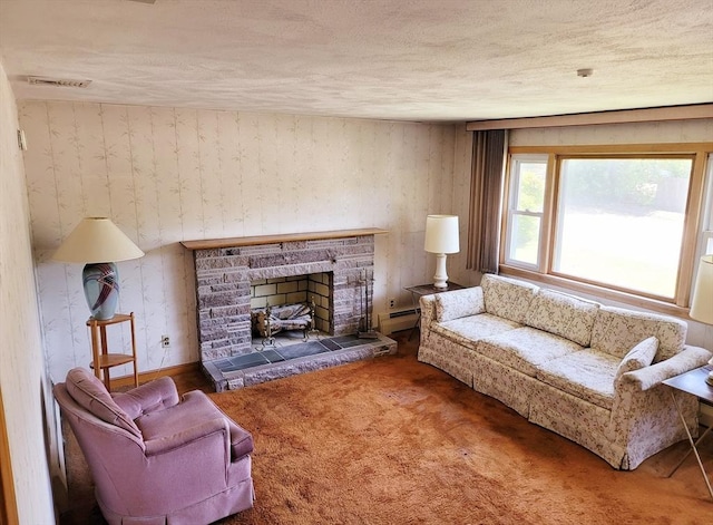carpeted living area featuring a baseboard radiator, a textured ceiling, and a fireplace