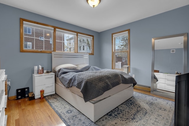 bedroom with light hardwood / wood-style flooring