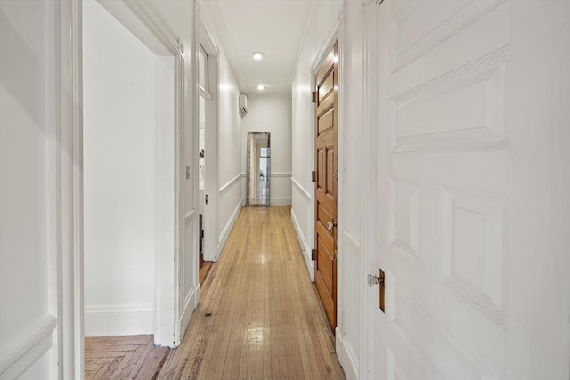 corridor featuring light hardwood / wood-style floors