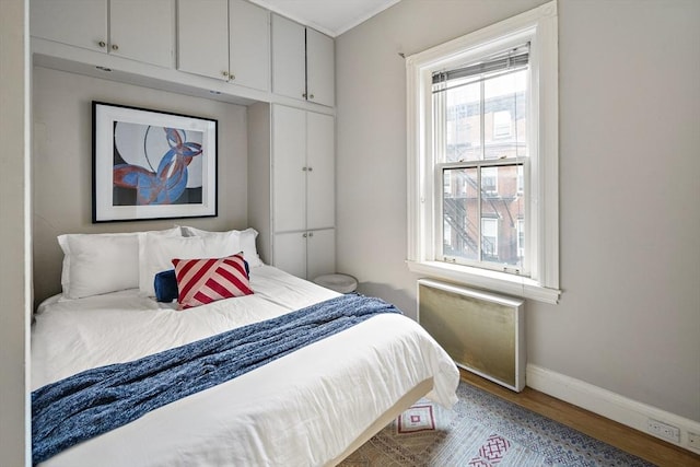 bedroom featuring hardwood / wood-style flooring