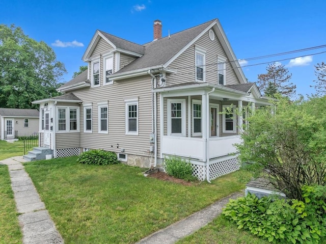 259 Main St, Blackstone, MA 01504 - view of home's exterior featuring a chimney, a yard, and roof with shingles