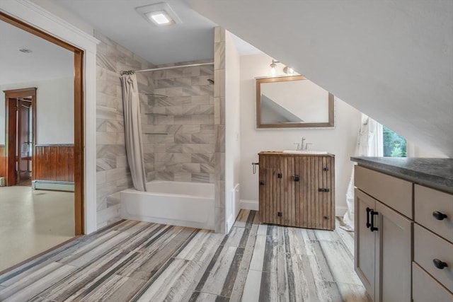 259 Main St, Blackstone, MA 01504 - full bath with vanity, shower / bath combo with shower curtain, a baseboard heating unit, wood finished floors, and baseboards
