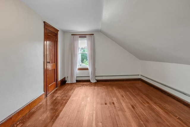 259 Main St, Blackstone, MA 01504 - additional living space with wood-type flooring, lofted ceiling, a baseboard radiator, baseboard heating, and baseboards
