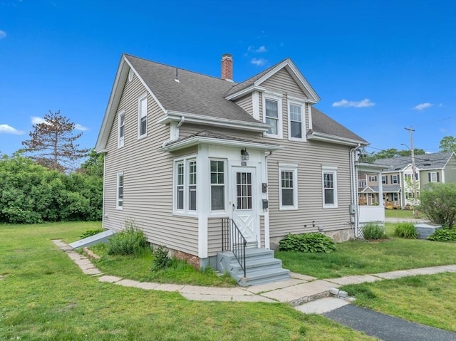 259 Main St, Blackstone, MA 01504 - view of front of property featuring entry steps, a chimney, a front lawn, and roof with shingles