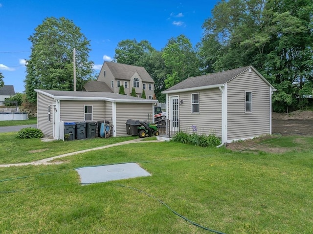 259 Main St, Blackstone, MA 01504 - rear view of house featuring a yard