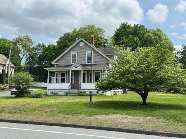 259 Main St, Blackstone, MA 01504 - view of front of house with a porch, a chimney, and a front yard