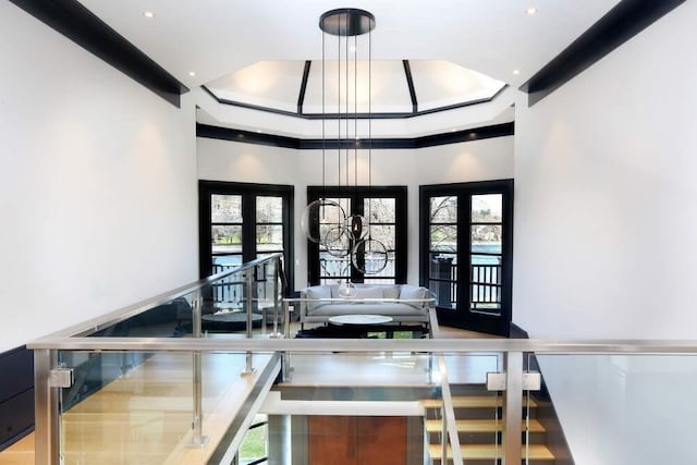 interior space featuring french doors and a towering ceiling