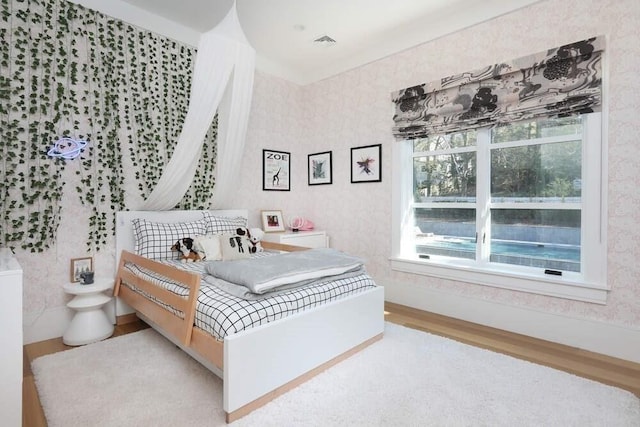 bedroom with wood-type flooring