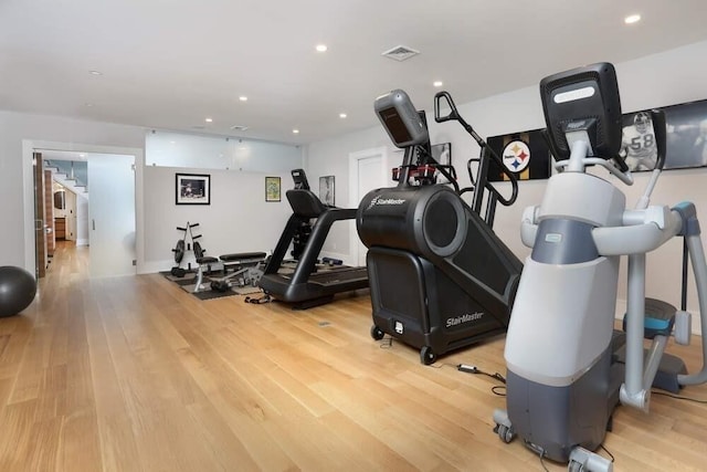 workout room with hardwood / wood-style flooring