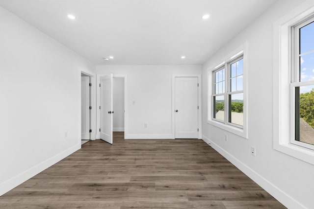 47 Parker St Unit 3, Quincy, MA 02169 - unfurnished bedroom with recessed lighting and wood finished floors